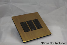 Load image into Gallery viewer, Vision 8-Gang Grid Faceplate for 3 Lutron Pico Controls, Layout: 111 with black Frame - Antique Brass (Metal Plated)